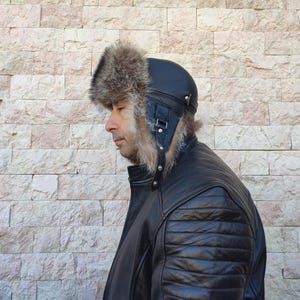 Pilot leather hat with raccoon fur