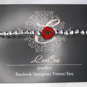 Czech glass poppy bracelet by LovEva. One pound donated to The Royal British Legion for each one sold.
