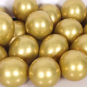 May include: A group of shiny gold balloons. The balloons are arranged in a close-up view, showing their reflective surface.