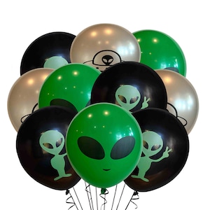 May include: A bunch of green, black, and silver balloons with alien faces and UFO designs.