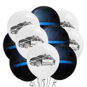 May include: A collection of white and black balloons. The white balloons feature a black and white police car graphic with the word "POLICE". The black balloons have a blue stripe. The balloons are tied together with black ribbon.
