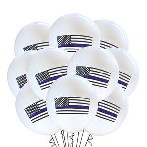 May include: A cluster of white balloons, each adorned with a graphic of the American flag featuring a blue line. The balloons are tied together with black ribbons, creating a festive and patriotic display.