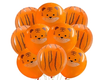May include: A set of nine orange balloons with tiger stripes and cartoon tiger faces. The balloons are tied together with strings.