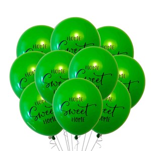 May include: A bunch of green balloons with the text "Home Sweet Home" printed on them.