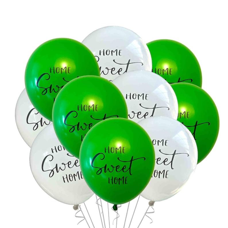 May include: A bunch of green and white balloons with the text "Home Sweet Home" written on them.