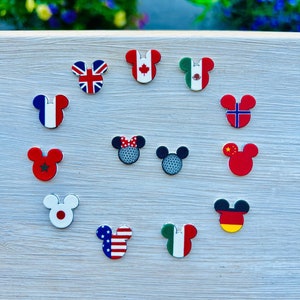 May include: A white ceramic mug with a black handle and the text "But First, Coffee" in a handwritten style. The mug is on a white surface. The mug is approximately 4 inches tall.