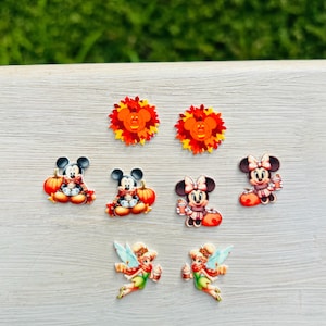 May include: A set of three ceramic mugs with a speckled, matte finish. The mugs are in shades of cream, light gray, and dark gray. Each mug has a simple, minimalist design, perfect for coffee or tea.