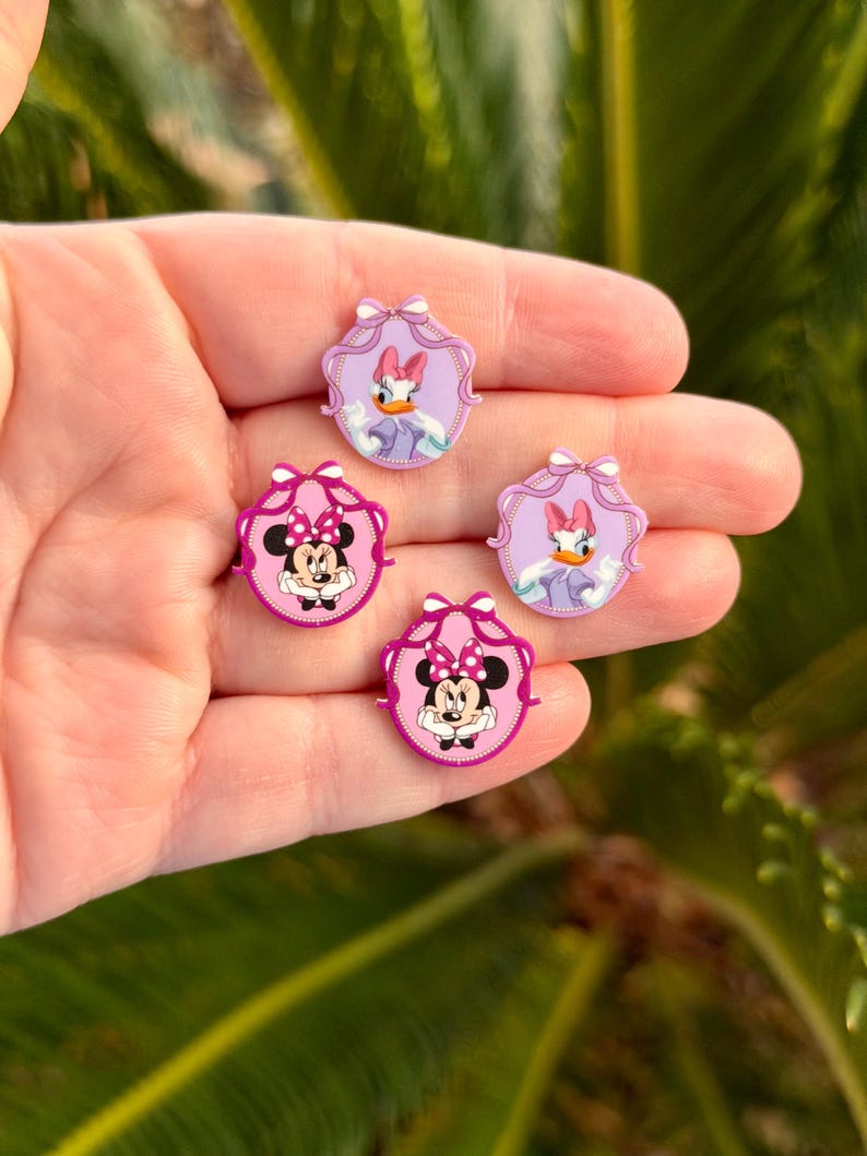 May include: A white ceramic mug with a black handle and the text "But First, Coffee" in a bold, black font. The mug is filled with a dark liquid, likely coffee, and sits on a light-colored surface.