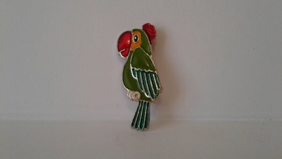 badge. The green parrot badge. Children's icon. Fi