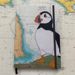 Carnet de notes A5 relié Puffin at Lundy par Hannah Wisdom Textiles | Thèmes côtiers sur d'anciennes cartes marines Devon