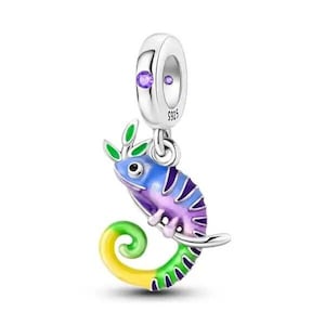 May include: A silver charm featuring a chameleon with a curled tail, enamelled in purple, blue, green and yellow. The charm has a small purple gem and the inscription "S925" on the top.