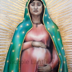 May include: A painting of the Virgin Mary, depicted with a blue and green robe and a gold halo. She is pregnant and holding her belly with both hands. The painting is signed "Nichole Lanthier Art".