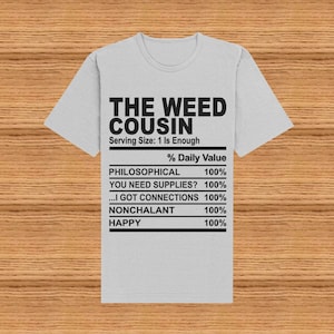 May include: A gray t-shirt with a black graphic that reads "The Weed Cousin" and lists the percentage daily value of philosophical, you need supplies, I got connections, nonchalant, and happy, all at 100%.