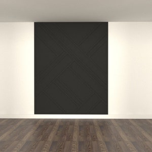 Op de afbeelding: Een witte kamer met een zwarte accentmuur met een geometrisch patroon. De muur is gemaakt van houten panelen met een reli&euml;fdesign. De vloer is van donker hout.