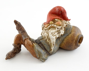 Garden Gnome Napping Against a Barrell