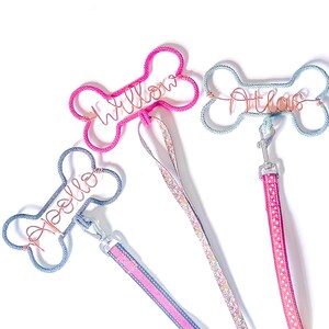 3 bone shaped dog lead hooks with personalised names in copper wire