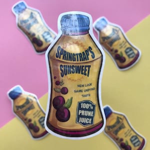 May include: A sticker of a cartoon juice bottle with a yellow and gold label. The label says "Springtrap's Sunsweet" and "100% Prune Juice". The bottle is surrounded by a white border.