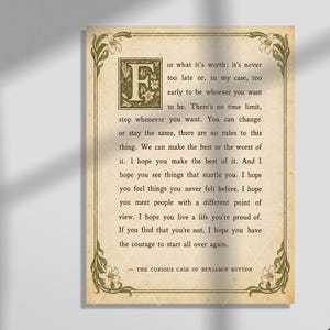 May include: A rectangular print on aged, parchment-style paper featuring a large, ornate letter F and the quote from The Curious Case of Benjamin Button. The text is framed by a decorative border with green lily illustrations in each corner.