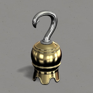 May include: A gold and silver pirate hook ornament with a round base and three legs. The hook is curved and has a sharp point.