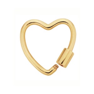 May include: A gold-colored heart-shaped clasp with a screw closure. The clasp is made of a shiny, metallic material and is designed to open and close. The heart shape is smooth and rounded, with a simple, elegant design.