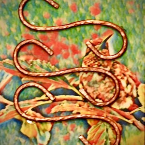 May include: Three copper-colored S-shaped hooks with a textured, hammered finish. Each hook features a curved design at both ends, providing a functional shape for hanging items. The metal surface displays a consistent metallic sheen throughout.