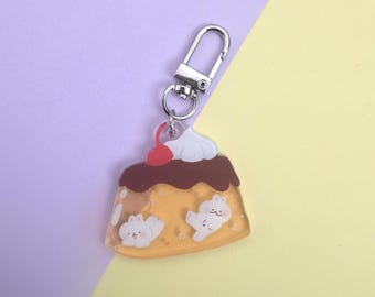 Charm acrílico de conejitos de pudín