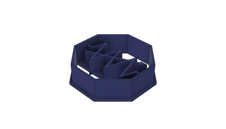 May include: A dark blue octagonal-shaped cookie cutter with a geometric design in the center.