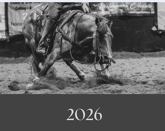 May include: Black and white image of a horse and rider in a cutting competition. The horse is mid-turn, kicking up dirt. The rider is seated, guiding the horse. The image has the number "2026" at the bottom.