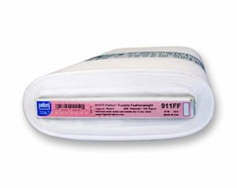 May include: A white roll of Pellon 911FF Fusible Featherweight interfacing. The label reads "911FF Pellon Fusible Featherweight Apparel Fabrics 90% Polyester 10% Rayon Machine wash warm and tumble dry low or dry clean www.PellonProjects.com 911FF Made in USA."