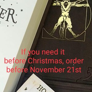 May include: Image of two Harry Potter books, one with a gold illustration and the other with the title. A Hogwarts Library card is visible. Text on the image reads: "If you need it before Christmas, order before November 21st."