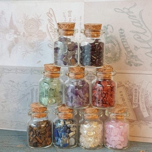 1 small glass bottle filled with rhinestones - glass wish bottles with cork - Nice for witch/wizard/fortuneteller/curiosities cabinets.