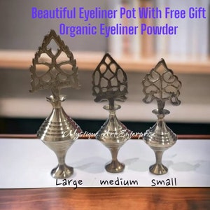 May include: Three silver metal eyeliner pots with ornate tree-shaped tops. The pots are labeled "large", "medium", and "small".