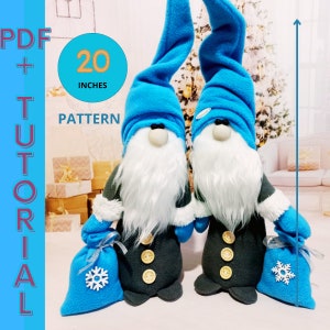 May include: Two blue and gray gnomes with white beards and blue hats. The gnomes are holding blue bags with snowflakes on them. The gnomes are 20 inches tall. PDF + TUTORIAL PATTERN.