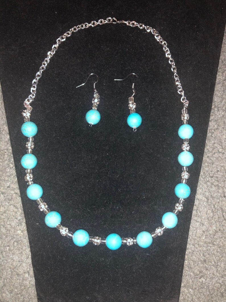 Turquoise necklace and earring set with silver accents