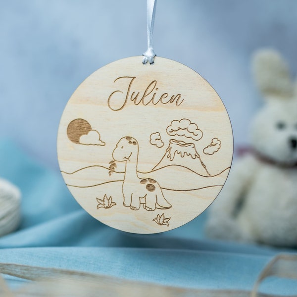 Personalized wooden birth announcement on the theme of prehistory for birth announcement or souvenir