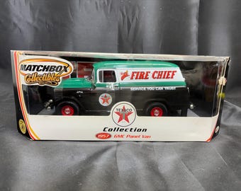 May include: Matchbox Collectibles 1957 GMC Panel Van toy in its original packaging. The model is black and green with red wheels and Texaco branding. The words "Fire Chief" and "Service You Can Trust" are printed on the side.
