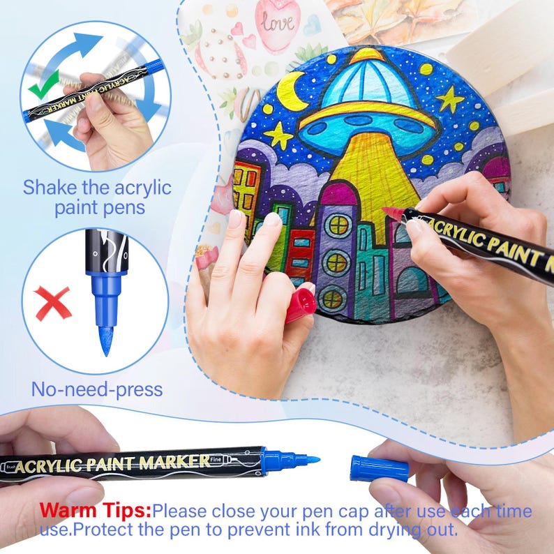 May include: A set of black acrylic paint markers with white lettering that says "Acrylic Paint Marker Fine". The markers have blue tips and are shown being used to color a round canvas with a drawing of a city and a UFO. The image includes instructions to shake the markers before use and to close the cap after use to prevent the ink from drying out.