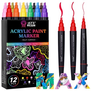 May include: A set of 12 acrylic paint markers in a variety of colors, including red, orange, yellow, green, blue, purple, pink, black, white, and light violet. The markers are packaged in a box with the text "Let's Resin Acrylic Paint Marker" and "Multi Surface".