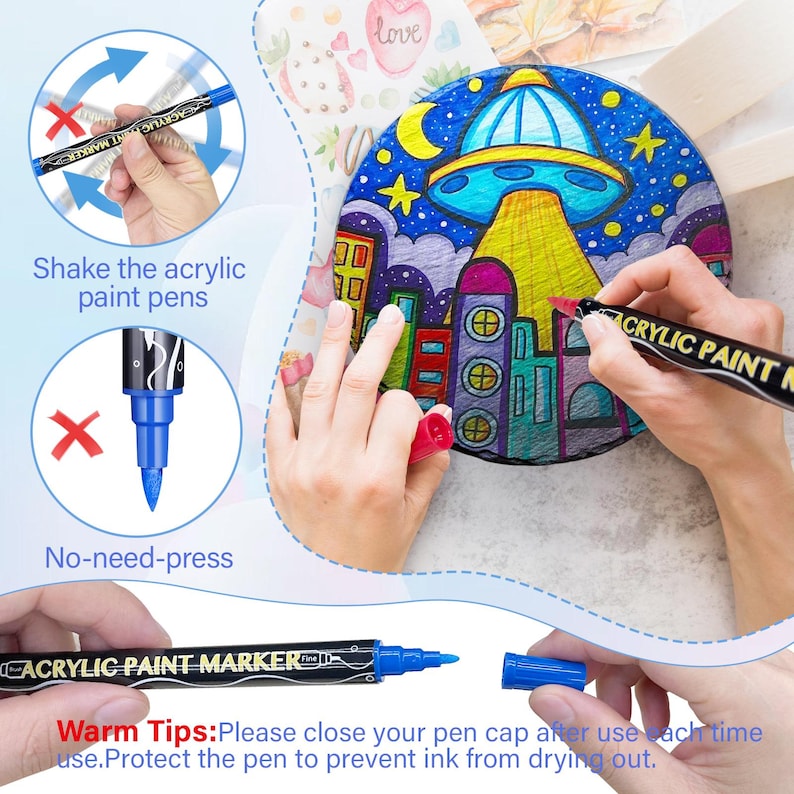 May include: A set of black acrylic paint markers with blue tips. The markers have the words "Acrylic Paint Marker" printed on the side. The image shows a hand holding a marker and shaking it, and another hand using the marker to color a drawing of a city with a UFO in the sky. The text "Warm Tips: Please close your pen cap after use each time. Protect the pen to prevent ink from drying out." is printed at the bottom of the image.