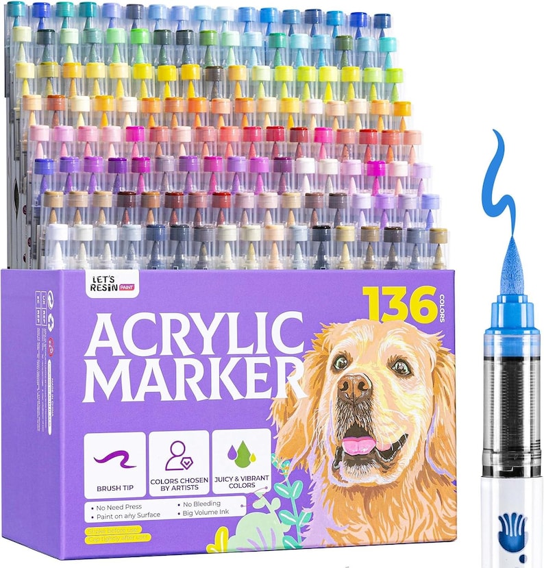 May include: A set of 136 acrylic markers in a variety of colors, displayed in a purple box with a golden retriever illustration. The box features text that reads "ACRYLIC MARKER" and details about the markers, including "Brush Tip" and "Juicy & Vibrant Colors."