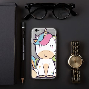 May include: A clear phone case with a cartoon unicorn design. The unicorn is white with a pink, blue, and yellow mane and tail. The unicorn has a rainbow horn and is smiling.