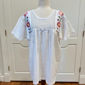 Artisanal Mexican top made with Hand Embroidery with silk threads.