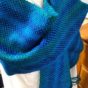 Hand woven scarf with multi color background