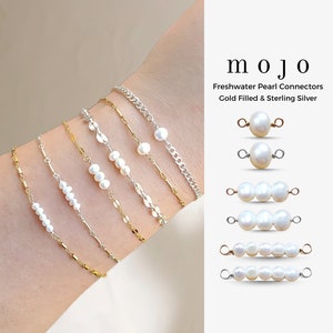 May include: A set of freshwater pearl connectors in gold filled and sterling silver. The connectors feature different lengths of pearls, ranging from one to four pearls. The pearls are white and round.