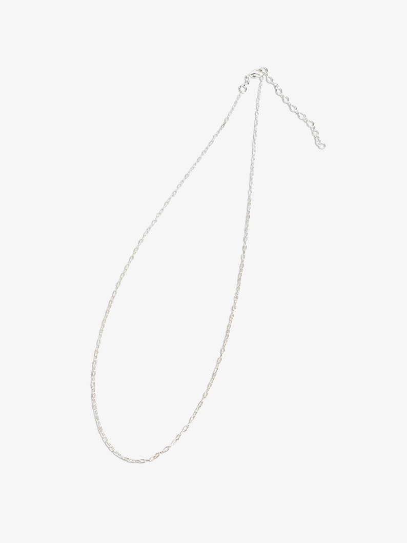 May include: A silver-toned metal chain necklace featuring delicate, interlocking oval links. The necklace includes a small circular clasp at one end and a short length of adjustable extender chain with larger links at the other end.