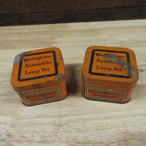 Mazda Lamp Tins, 2 Orange and Black Westinghouse Automobile Lamp Kit Tins