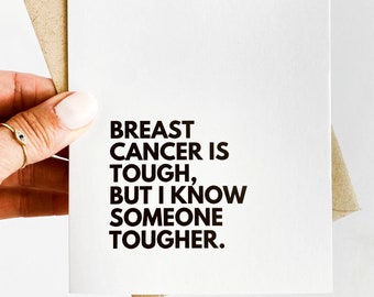 May include: A white card with black text that reads "Breast cancer is tough, but I know someone tougher."