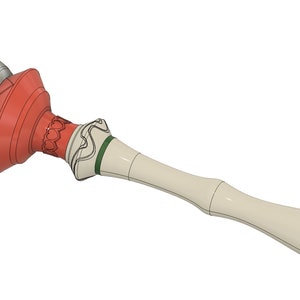 Può includere: Un bastone decorativo bianco e verde con una palla rossa e argentata in cima. La palla ha un motivo geometrico.