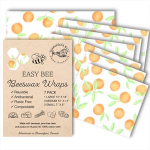 May include: A set of seven beeswax food wraps featuring an orange citrus design. The wraps are reusable, antibacterial, plastic-free, and compostable. The set includes one large wrap (13 inches by 14 inches), three medium wraps (10 inches by 11 inches), and three small wraps (7 inches by 8 inches).