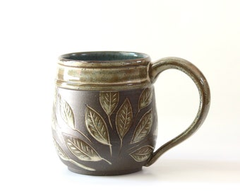 Soothing leaves carved pottery mug